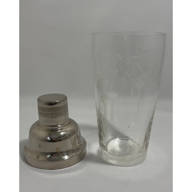 Elegant vintage Japanese barware set featuring a matching cocktail shaker and decanter decorated with a delicate etched...