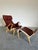 Swedish Mid Century Modern Lounge Chair and Ottoman set designed by Bruno Mathsson for DUX. Deep chocolate brown leather...