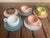 These mid-century modern pieces are Russel Wright "American Modern" demitasse / espresso cups and saucers, originally...