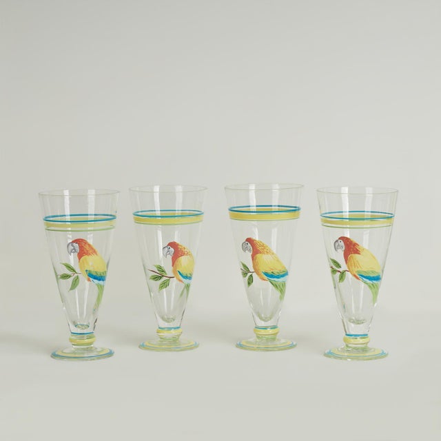 Striking vintage set of eight drinking glasses hand decorated with parrots and stripes having a classic sling glass form,...