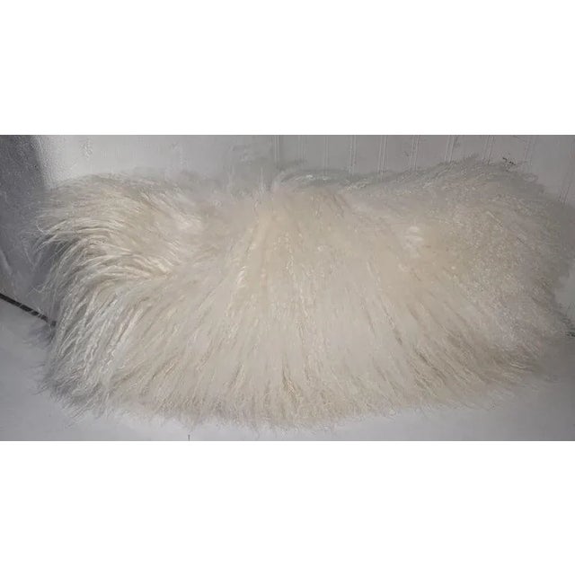 Two contemporary sheep skin white fur pillows. Both pillows are soft and supple. Very comfortable to the touch. Both...