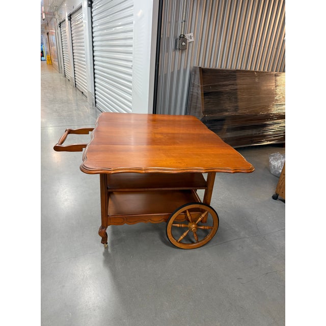 Vintage, Colonial, Wooden Tea / Serving / Bar Cart. Drop leaf extensions creat table top. 2 shelves and drawer. Handle can...