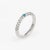 Elegant Adolfo Courrier stacking ring, crafted in 18 karat white gold. One estimated 0.05 carat turquoise, accented with...
