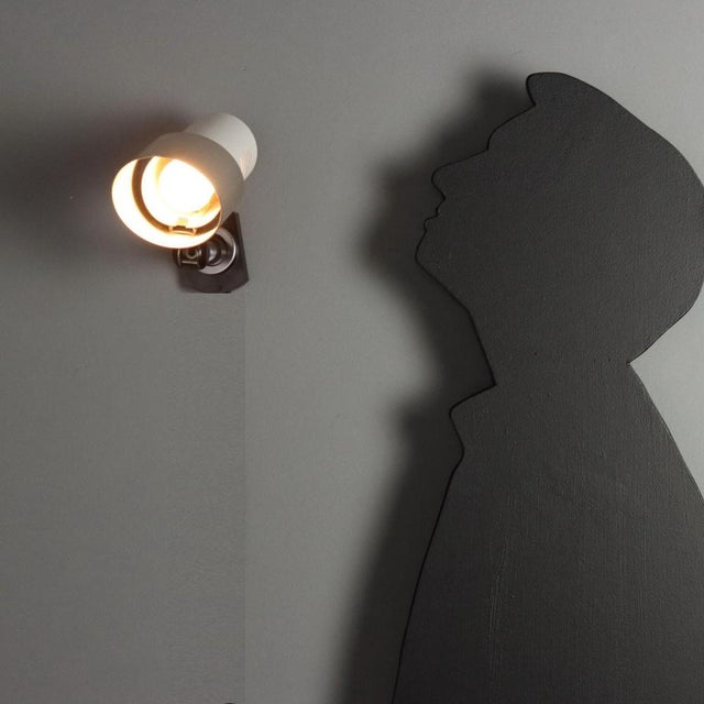 Adjustable lamp with joint, chromed and enamelled aluminium. This piece is attributed to the mentioned designer/maker. It...