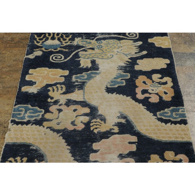 Hand-knotted in wool, this 3x7 antique Ningxia pillar runner is a historic example of early 20th-century Chinese weaving....