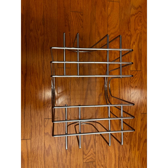 This simple but sophisticated magazine rack comes in a modernist construction in chromed steel, thought to be created by...