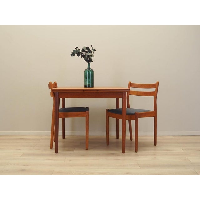 The table was made in the 1970s, Danish production. The frame and tabletop are covered with teak veneer. The legs are made...