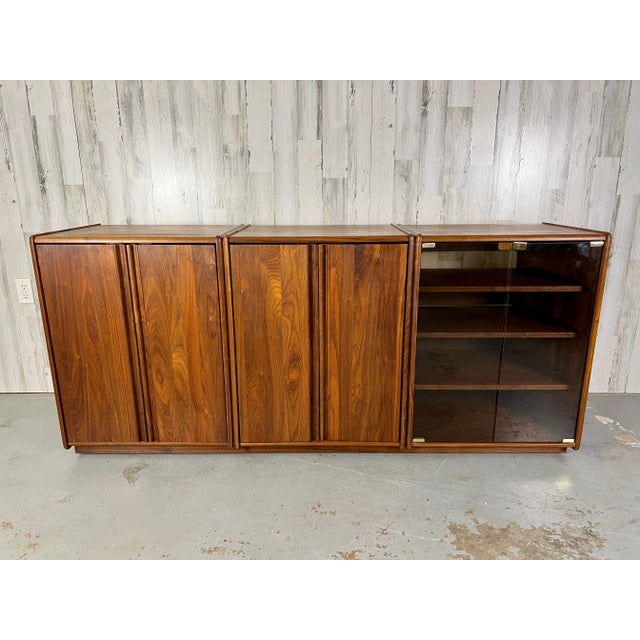 Studio crafted solid walnut modular cabinet system. There are two cabinets with solid walnut doors an one cabinet with...