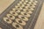 A tribal Bokhara Jaldar rug hand-knotted with fine wool on a cotton foundation. This rug features rows of repeating...