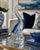 A striking vintage art glass swan sculpture featuring a graceful elongated neck, vibrant cobalt blue accents, and...