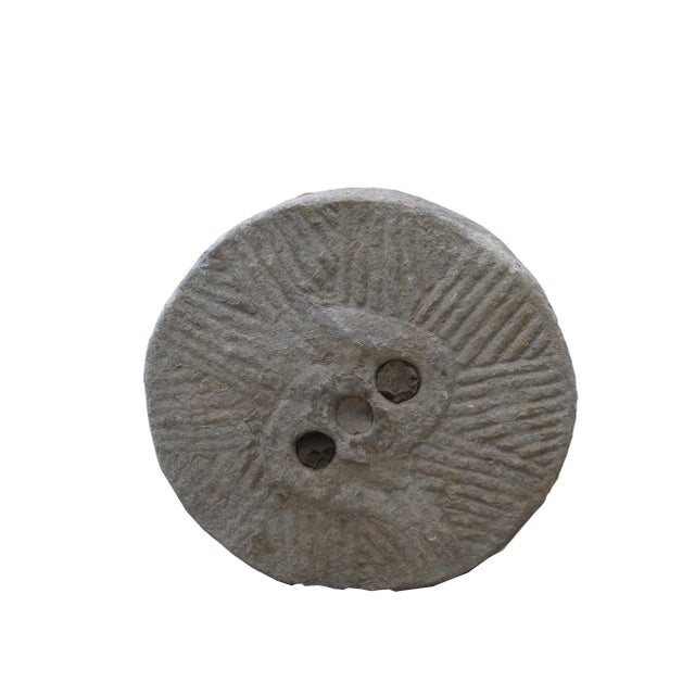 This top of a watermill stone was retrieved from the northern part of China. It was originally used for grinding grains....