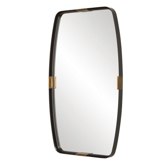 This sculptural metal mirror makes a bold design statement with its softly rounded corners and gently curved sides,...