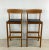 This Pair of Vintage Scandinavian Style Teak Bar Stools from Benny Linden are the epitome of sleek sophistication and...