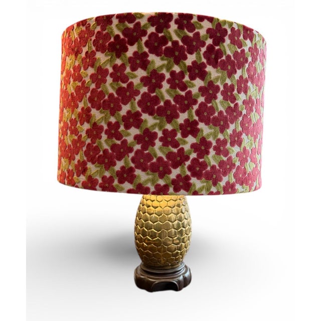 A cheerful and vibrant lamp shade crafted in Gretchen Punch “Regal” designer fabric, featuring a lively pattern of maroon...