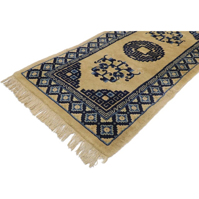 antique Chinese Baotou rug with Art Deco style. This hand-knotted wool antique Chinese Baotou rug features a rounded...