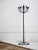 A hand crafted wrought iron candelabra by artist Gregory Litsios. Heavy iron base supports 13 candle inserts for various...