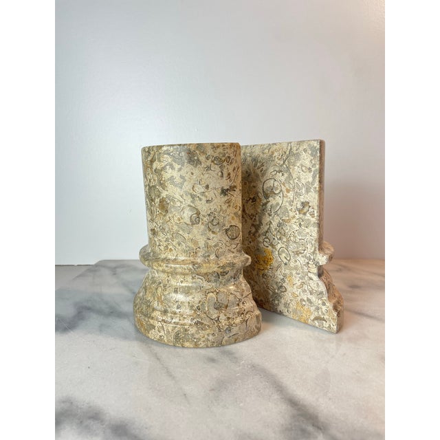 Striking pair of Postmodern fossil stone column bookends, showcasing the raw beauty and natural variation of sedimentary...