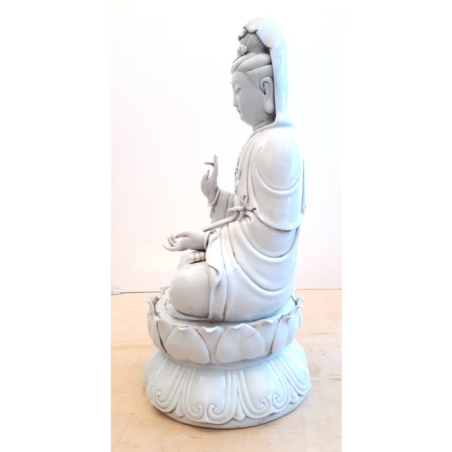 Chinese DeHua porcelain seated Ru Yi Kuan Yin , a finely carved seated Kuan Yin, clothed in flowing robes, tiara and...