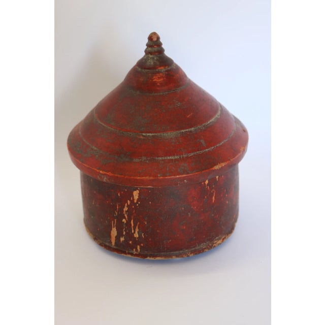 Small red box with lid. From India. Wear with age.