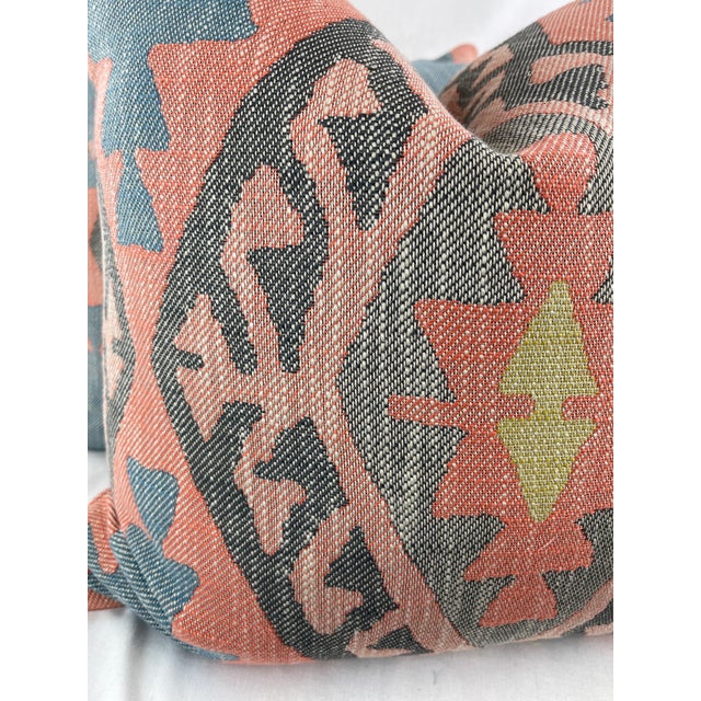 Custom pair of 22" pillows covered in a woven fabric in a large scale ikat pattern in multi. These pillows have tapered...