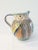 Charming large Italian pottery handled, pinched spout pitcher in a colorful hand-painted folk motif. Marked underside...