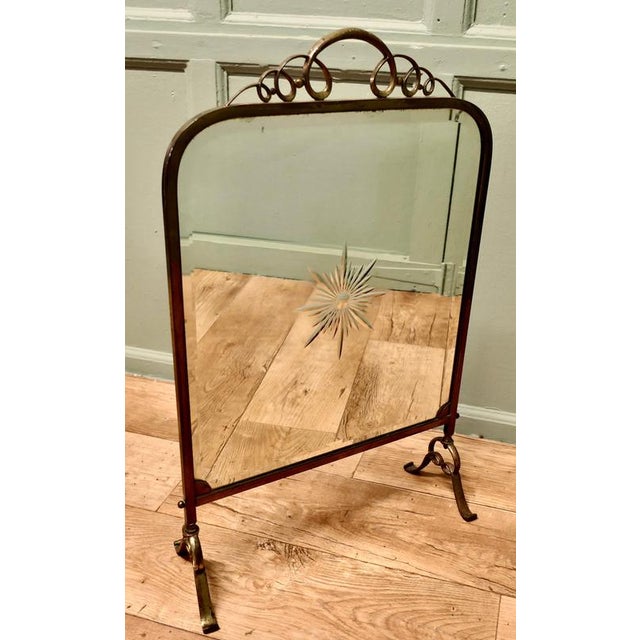 A Fine Quality Art Deco Brass and Sunburst Mirror Fire Screen This is a decorative Fire Screen it has a brass frame and...