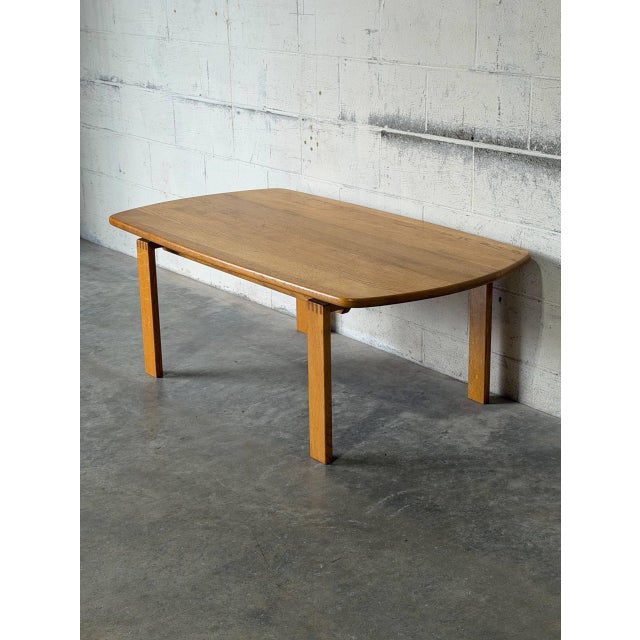 This oak coffee table features a clean rectangular top supported by sturdy square legs with distinctive finger-joint...