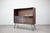 Refined Danish mid-century cabinet from the 1960s showcasing clean Scandinavian modern lines and practical functionality....