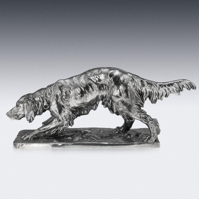 Antique 20th Century Continental silver-plated hunting dog. Finely crafted and impressive in scale, this statue portrays a...