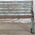 Vintage Indian Painted Teakwood and Iron Bench, a charming garden bench retaining some of its old blue paint finish. This...
