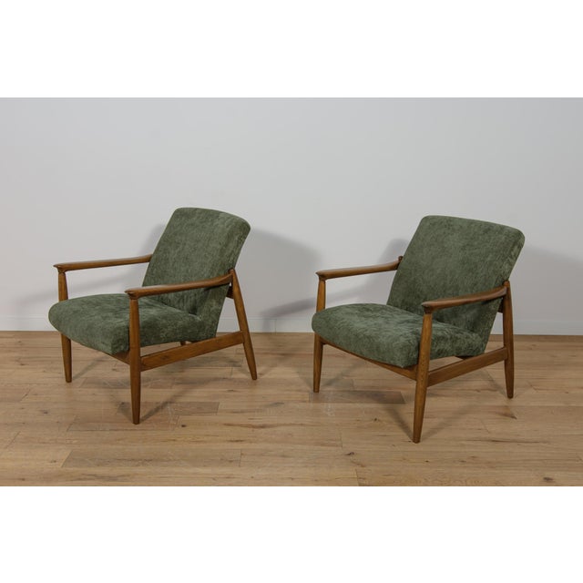 The pair of GFM-64 armchairs was designed in the 1970s by Edmund Hom. Due to its compact form, full frame and preserved...