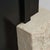 Mirror in limestone and glass, contemporary sculptural design. A slender rectangular mirror rises through a precise cut in...