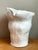 This biomorphic sculptural white ceramic vase combines the presence of a small sculpture with the function of a decorative...