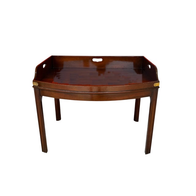 This is an elegant vintage Kittinger mahogany butler's tray table, featuring a large removable-style raised tray top with...