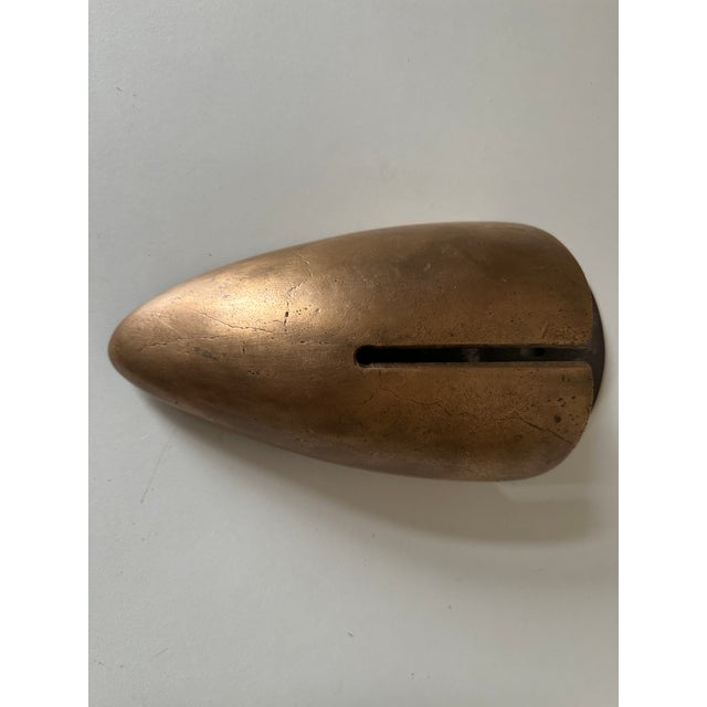 A very pretty, solid bronze wall sconce with an openwork design and a metal back. It has a brass socket (bulb not...