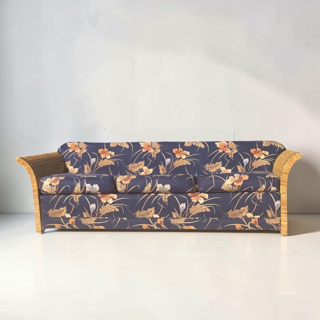 Beautiful vintage wicker rattan sofa. This sofa has a stunning organic colored wicker wrapped armrest which have a very...
