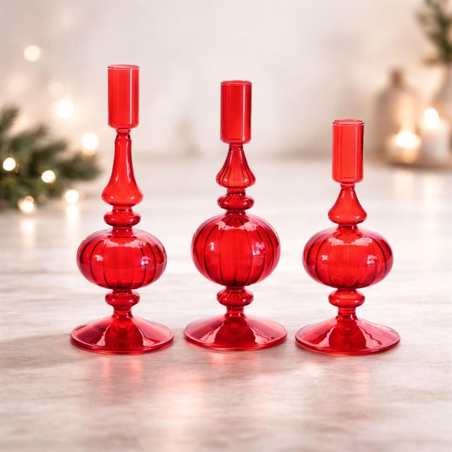 Add a playful yet elegant accent to your space with this set of glass candle holders. Delicate and light-catching, these...