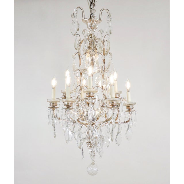 A refined late 19th-century French Louis XVI Revival chandelier in nickel-plated brass and hand-cut crystal. This elegant...