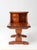 A vintage 1970s pine end table with a charming two-tier design, featuring a raised gallery, two small drawers with white...