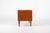 This charming compact sideboard was made in Denmark in the 1960s. It has two sliding doors with beautiful square carved...