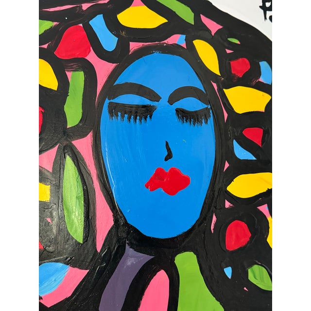 A striking, colorful portrait signed Pulgini, rendered in bold modernist strokes and jewel-toned blocks of color against a...