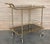 Fabulous brass bar cart with smoked glass Proudly showcase your finest decanters and stemware! Brass handle. This piece is...