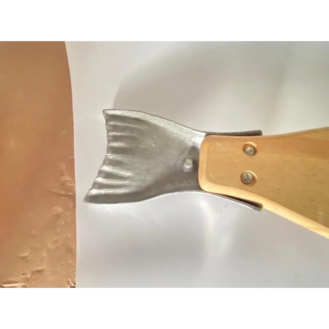 Wooden cutting board, It is an object of the French 20th century, in the style of French Provincial which is brown in...