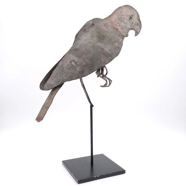 A tole folk art parrot on later stand, possibly French or French colonial, circa 1900.