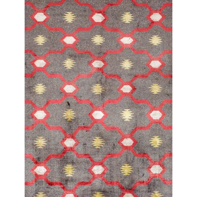 A vintage Indian room size rug from the mid-20th century. The carpet is in the style of Cotton Agra carpets, but made of...