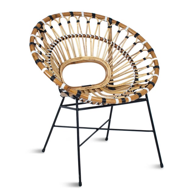 Charming boho chic bamboo ring chair with black iron base. Woven bamboo and rattan circular lounge seating area. Great for...