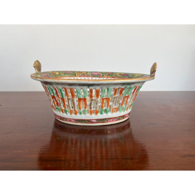 Chinese, 19th century. An antique Chinese export porcelain chestnut basket. The basket features traditional famille rose...