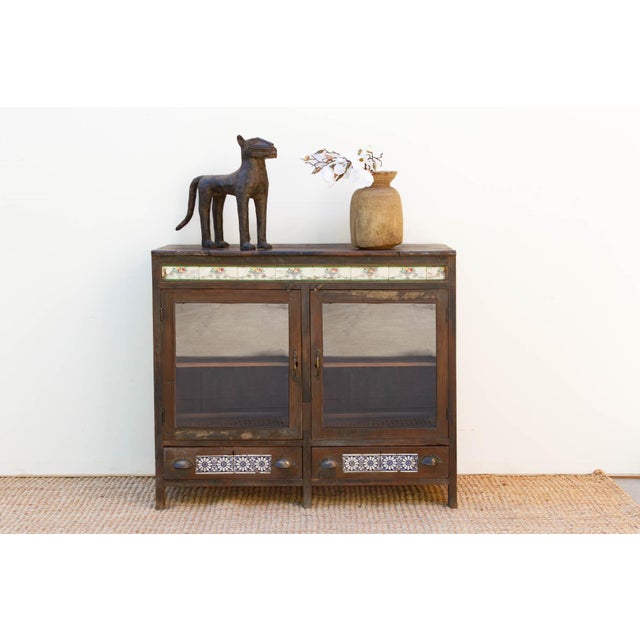 This Goa Cabinet is a soulful, mid-sized architectural anchor that captures the eclectic essence of coastal colonial...
