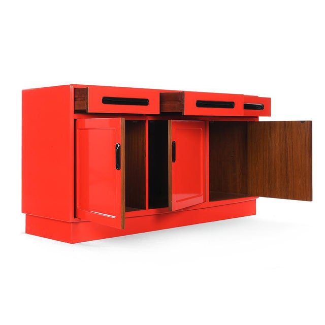 Red lacquered wood sideboard with 3 cupboards and 3 drawers. Red lacquered vintage storage cabinet. It has 3 cupboards and...