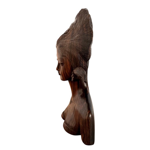 6”W x 9 1/4”H x 2 3/4”D A breathtaking testament to mid-century global modernism, this hand-carved Balinese bust is a...